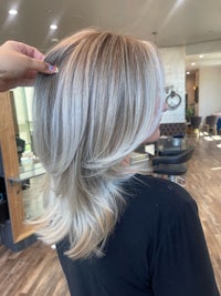 a woman getting her hair done in a salon