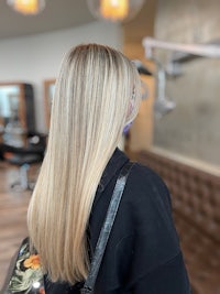 the back of a woman's hair in a salon