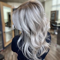 the back of a woman's hair in a salon