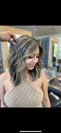 a woman getting her hair done in a salon