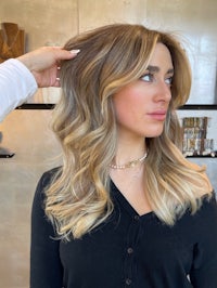 a woman getting her hair done in a salon