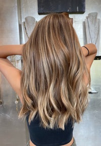 the back of a woman's hair in a salon