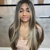 a woman with long blonde hair in a salon