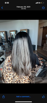 a woman's hair in a leopard print shirt