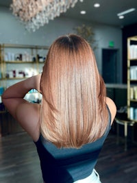 the back of a woman's hair in a salon